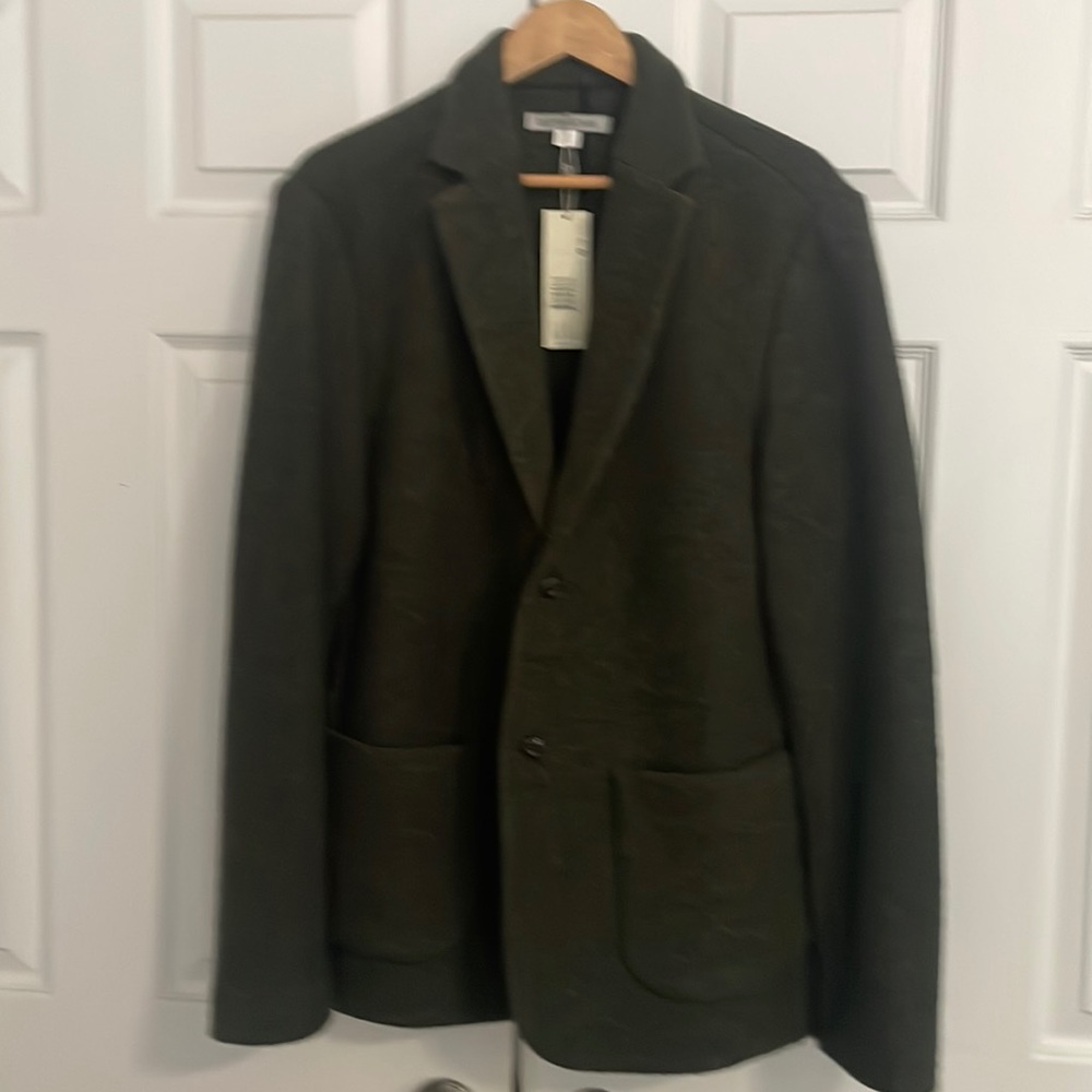 Outerknown Ambassador Blazer XL. It’s a dark green with hints of gold